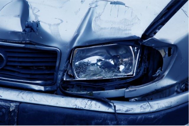 damaged car headlight after a crash