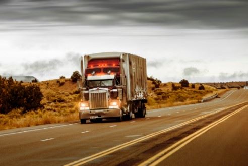 semi truck driving on the highway in North Dakota