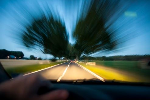 drunk driver weaving out of lane on road