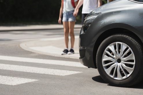 kids waiting to enter pedestrian crosswalk