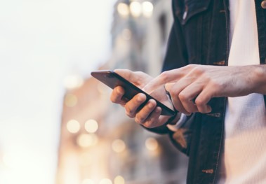 man using social media app on his phone