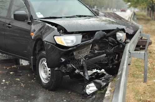 passenger vehicle crashed into guardrail